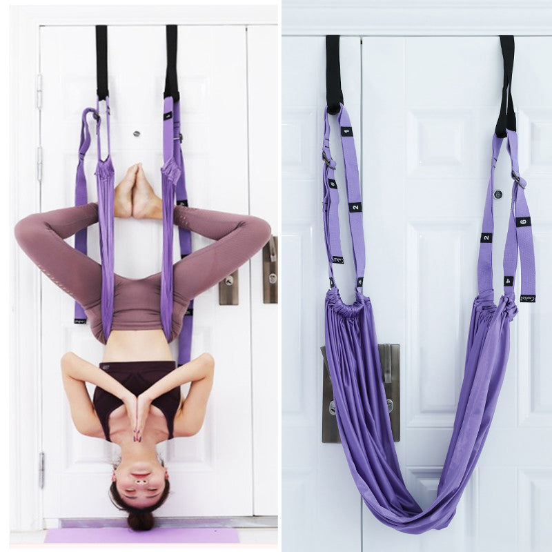 Woman stretching with a door yoga strap