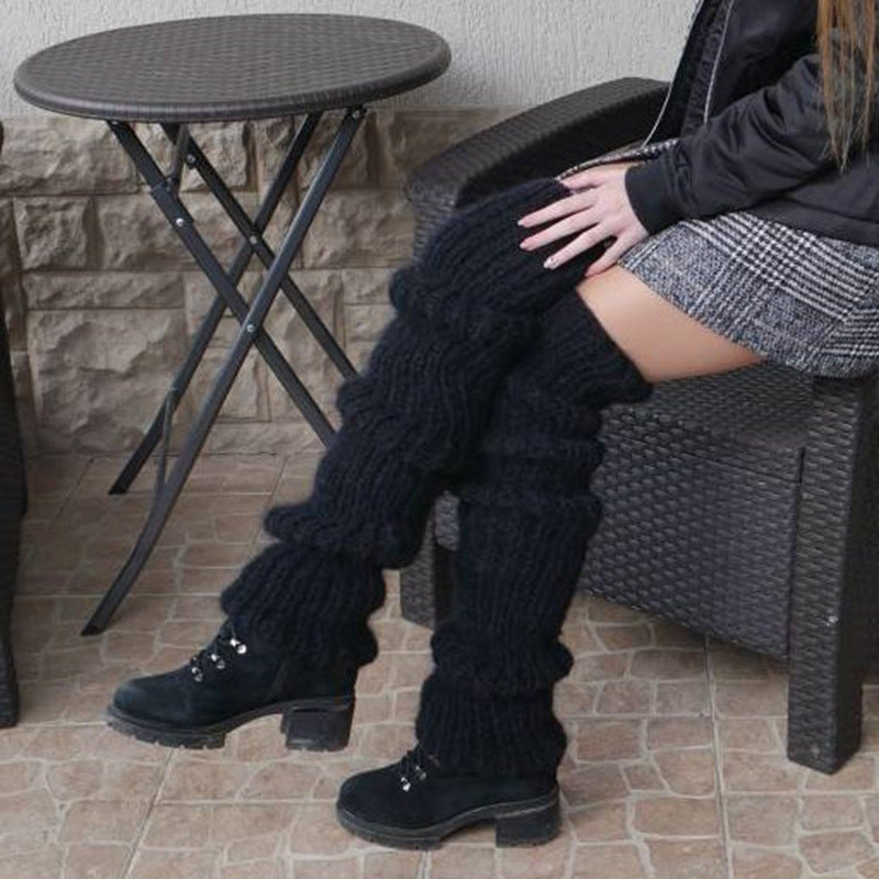 Chunky slouchy knit leg warmers over boots