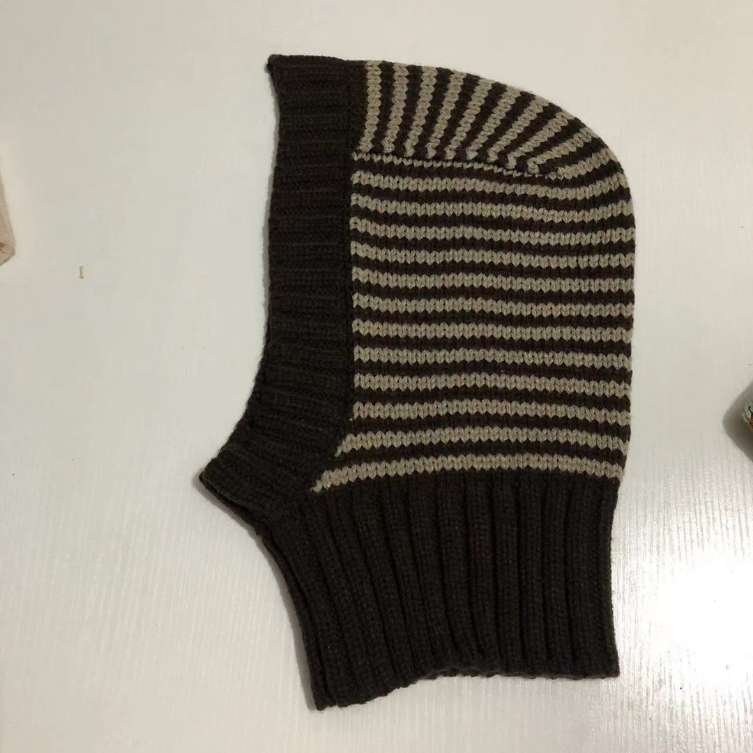 Person wearing striped knit balaclava hood