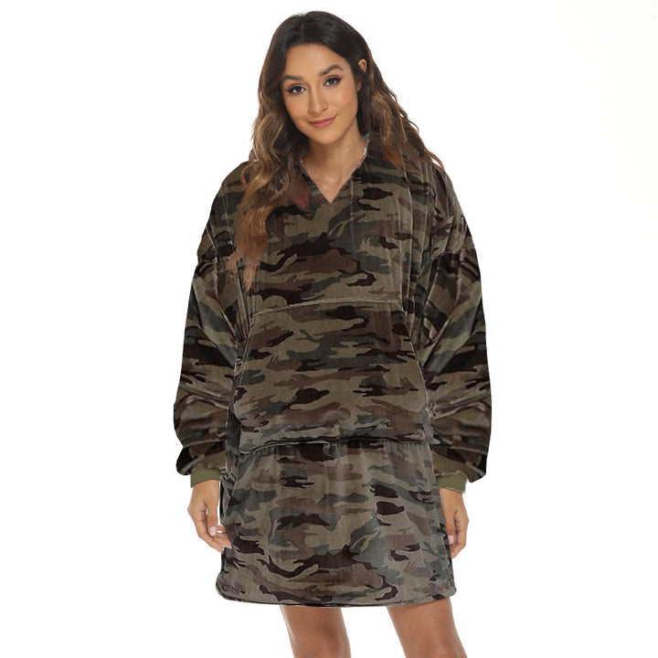Person wearing oversized hooded blanket