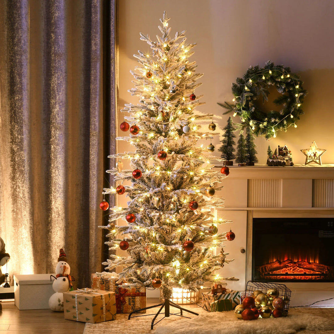 Snow flocked Christmas tree with clear lights