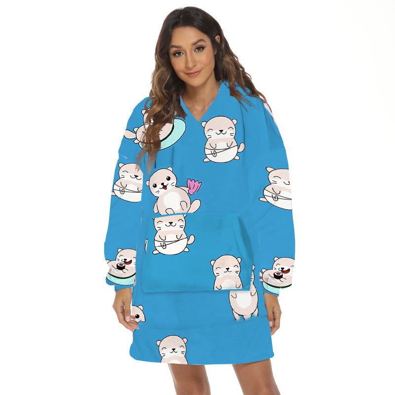Person wearing oversized hooded blanket