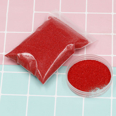 Colorful magic sand in water