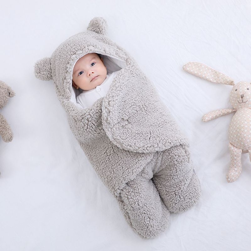 Baby in a bear ear sleep sack