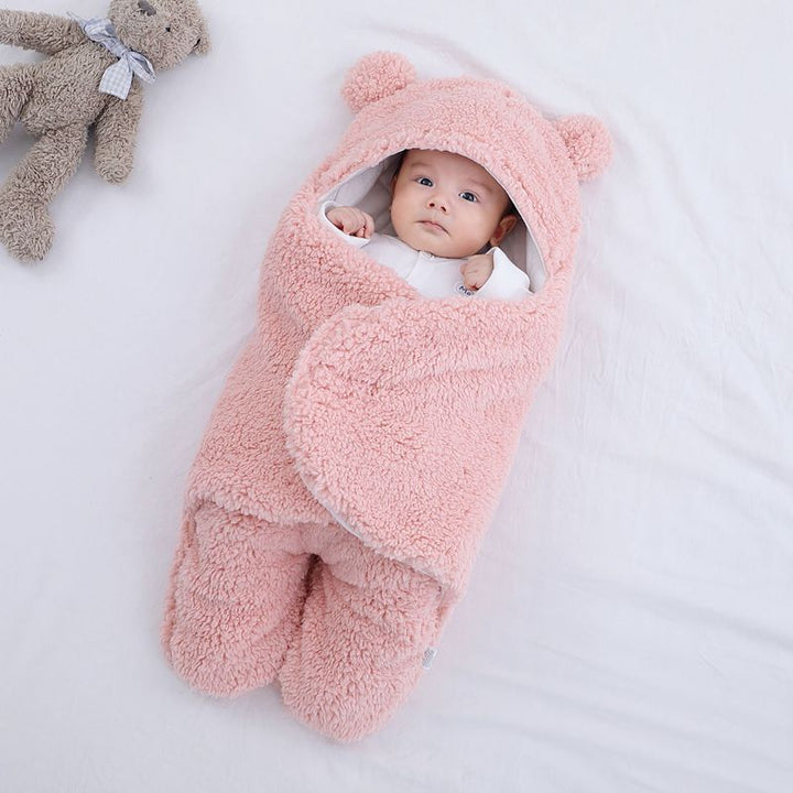 Baby in a bear ear sleep sack
