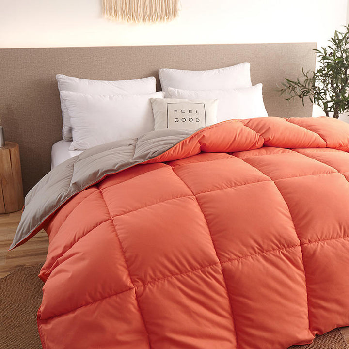 Quilted winter comforter on a made bed