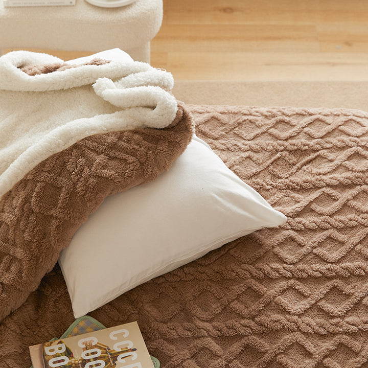 Tufted faux fur throw on a sofa