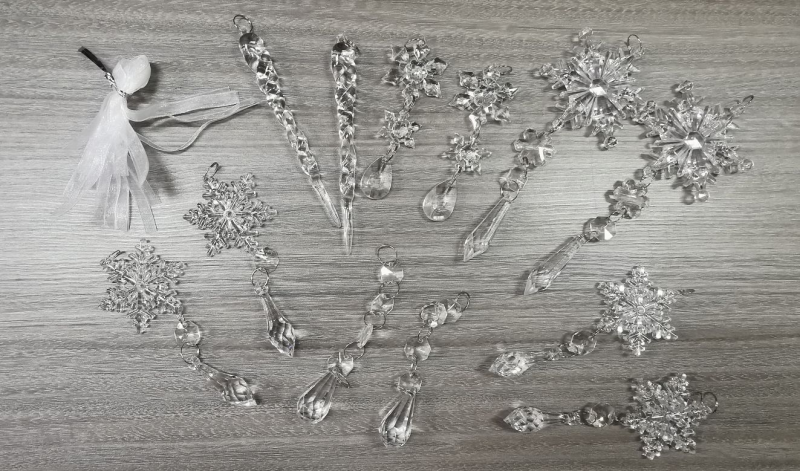 Clear acrylic icicle ornaments hanging on a Christmas tree