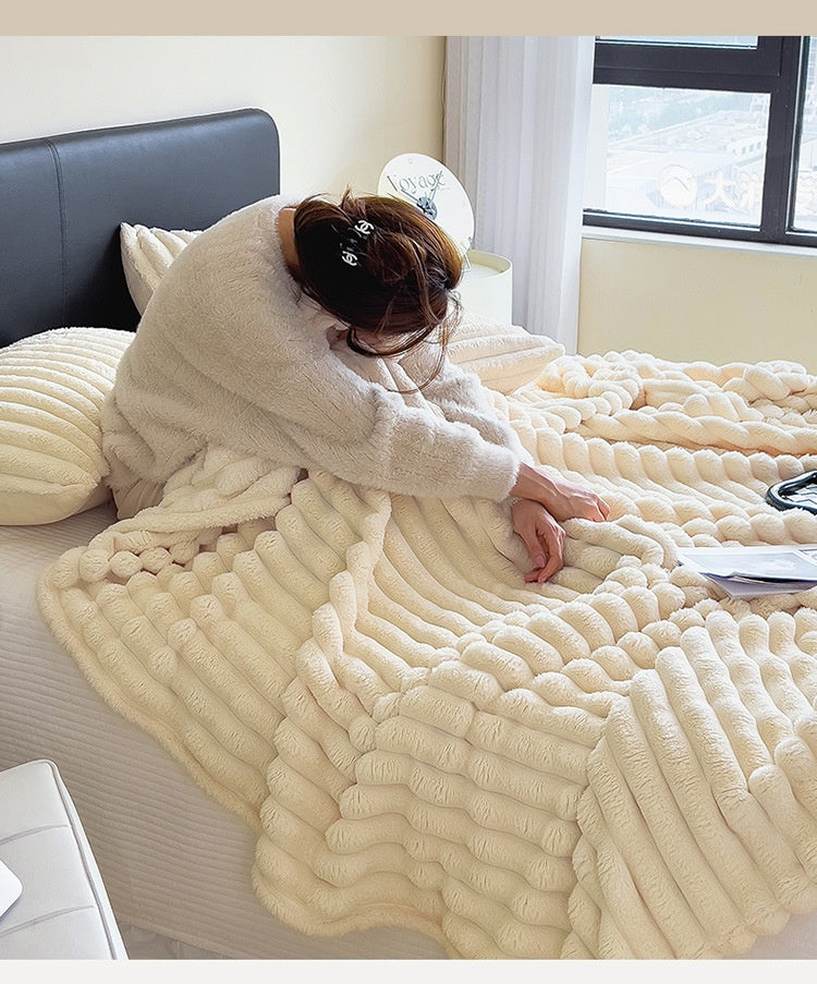 Ribbed faux fur blanket on a sofa