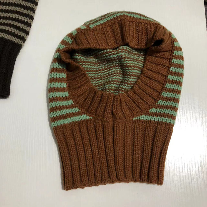 Person wearing striped knit balaclava hood