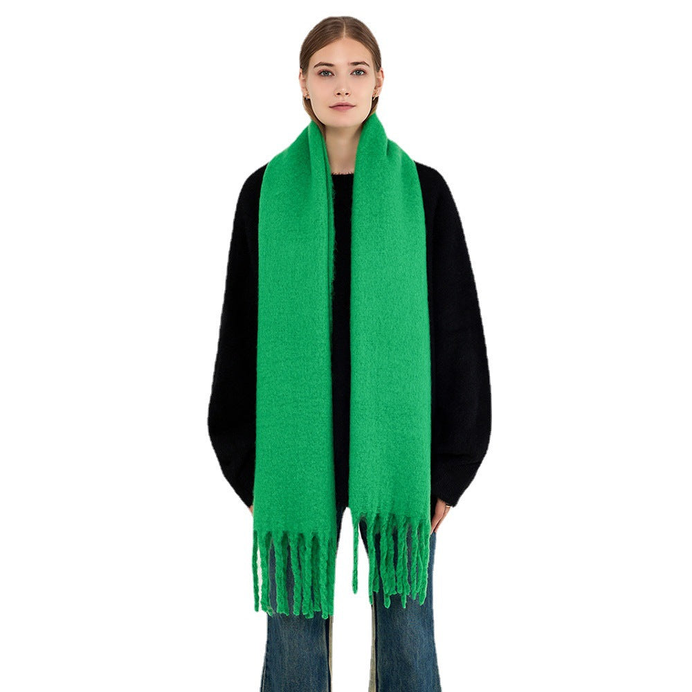 Woman wearing a fluffy royal blue scarf
