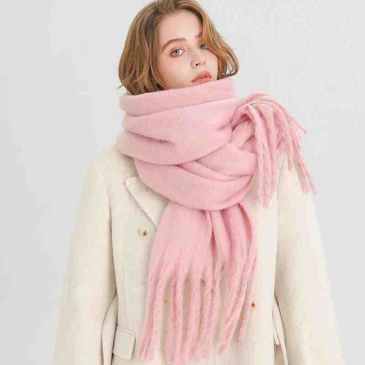 Woman wearing a fluffy mustard scarf