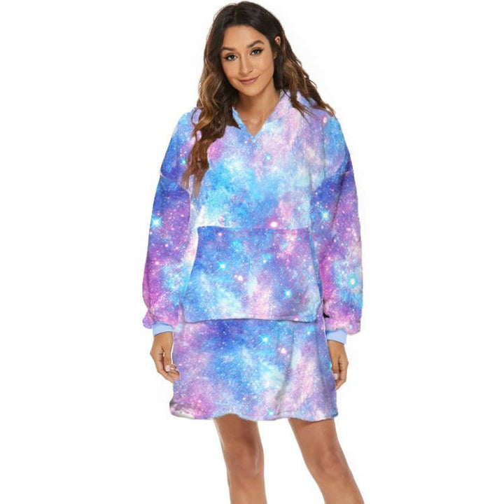 Person wearing oversized hooded blanket