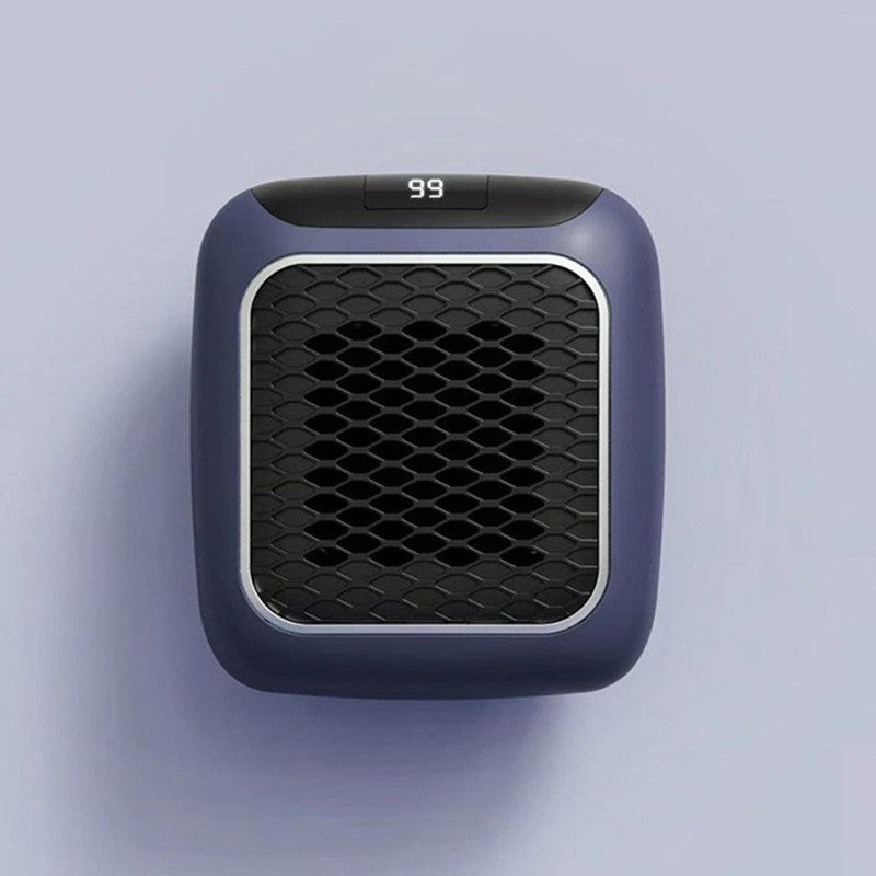 Mini plug in heater on a wall outlet