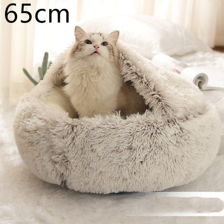Cat curled up in a round plush bed with hood
