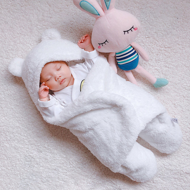 Baby in a bear ear sleep sack