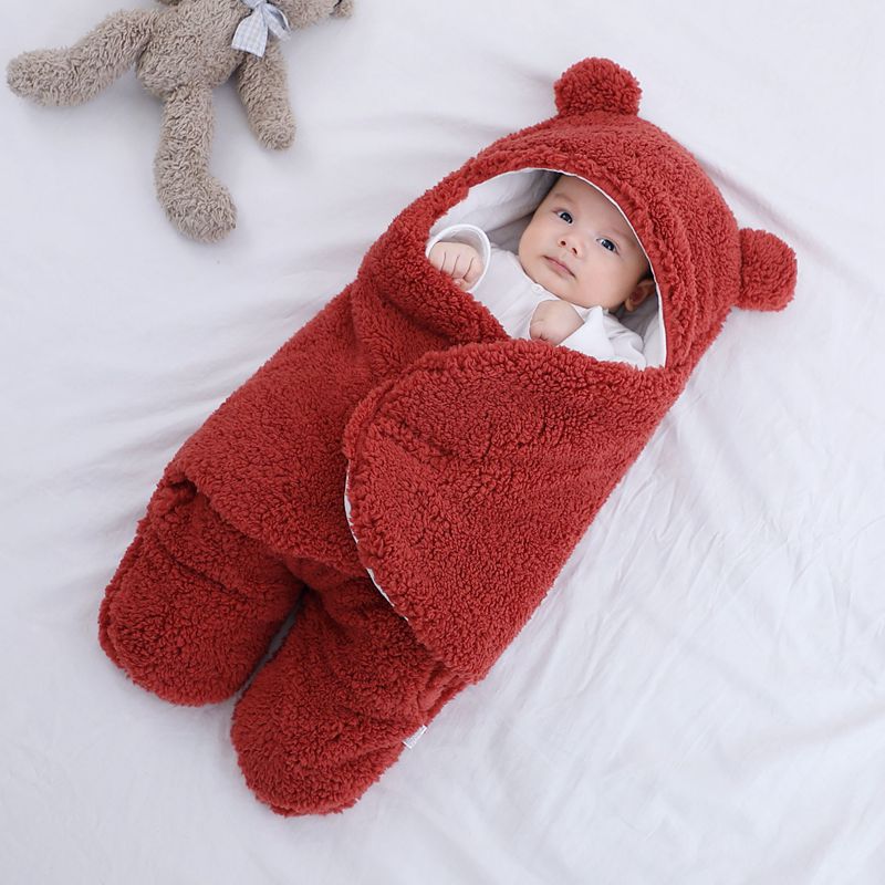 Baby in a bear ear sleep sack