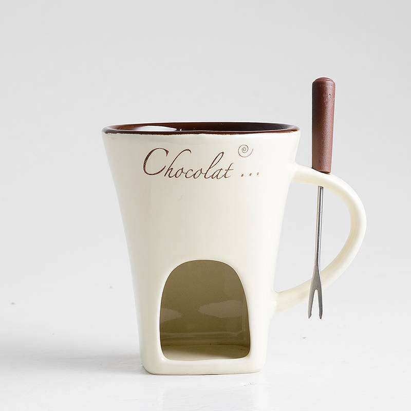 Ceramic fondue mug with fork and tealight