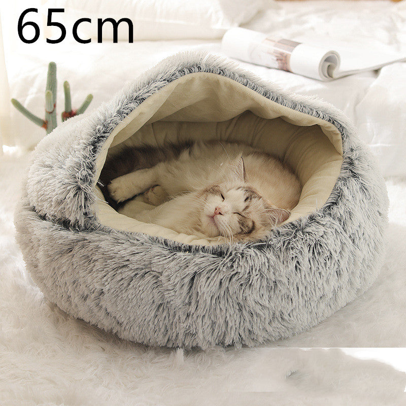 Cat curled up in a round plush bed with hood
