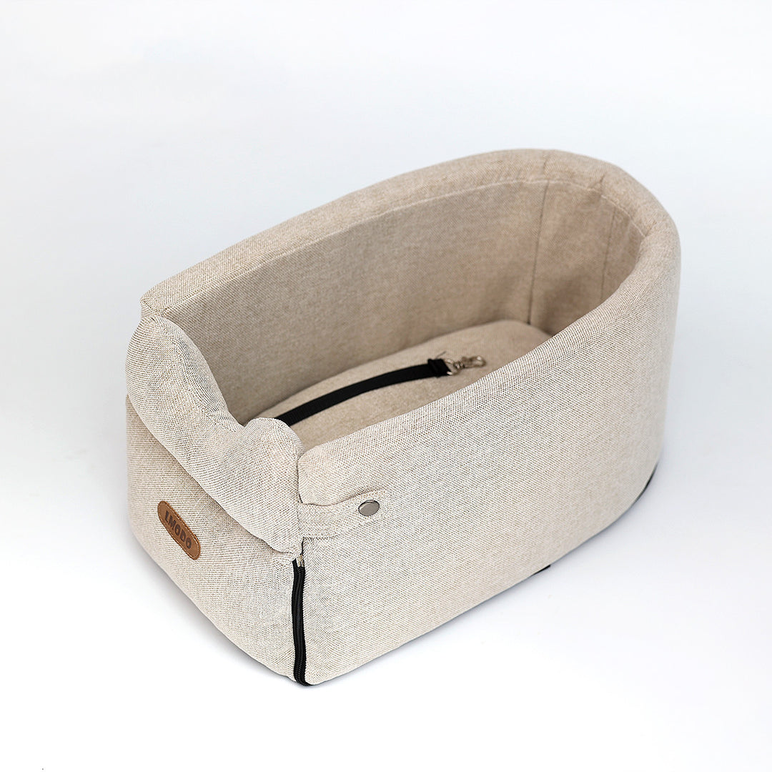 Small dog in armrest car seat bed