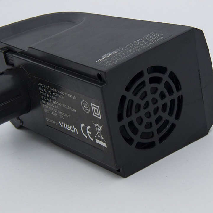 Small ceramic heater plugged into a wall outlet