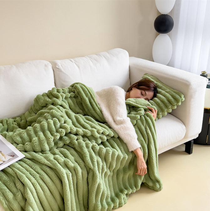 Ribbed faux fur blanket on a sofa