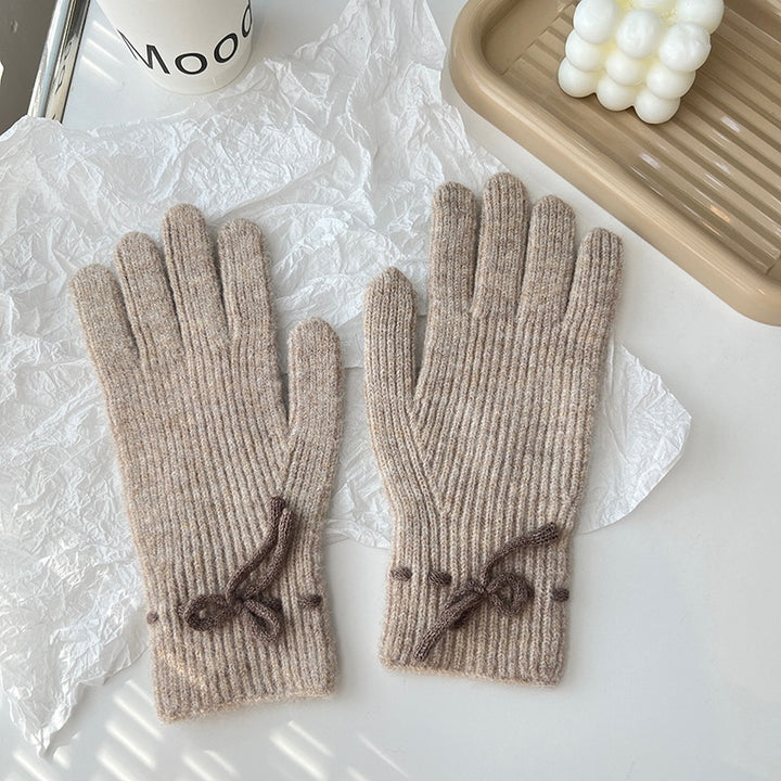 Pink ribbed knit gloves with bow