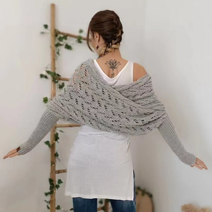 Woman wearing a knit shawl with sleeves
