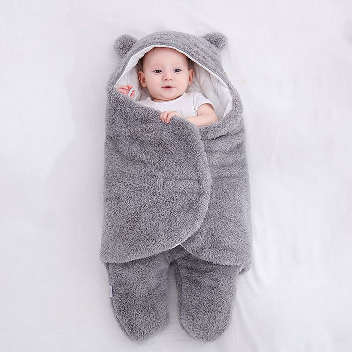 Baby in a bear ear sleep sack