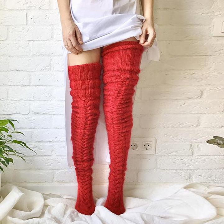 Woman wearing over-the-knee cable knit socks