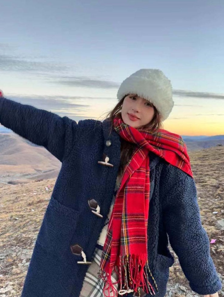 Woman wearing a red tartan scarf