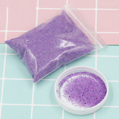 Colorful magic sand in water