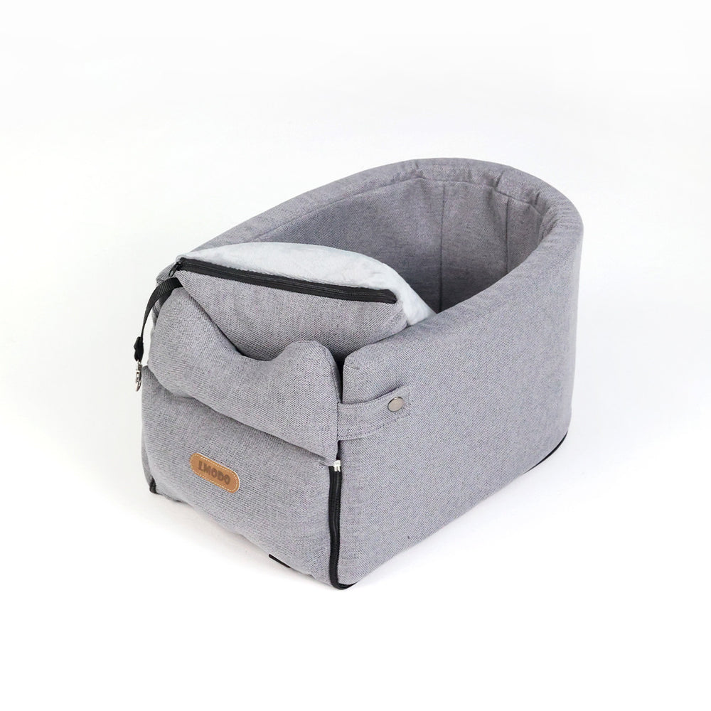 Small dog in armrest car seat bed