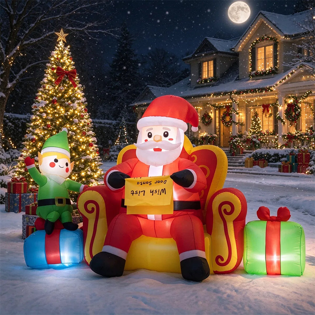Inflatable Santa on sofa with elf