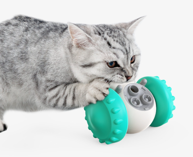 Wobbling robot treat dispensing pet toy