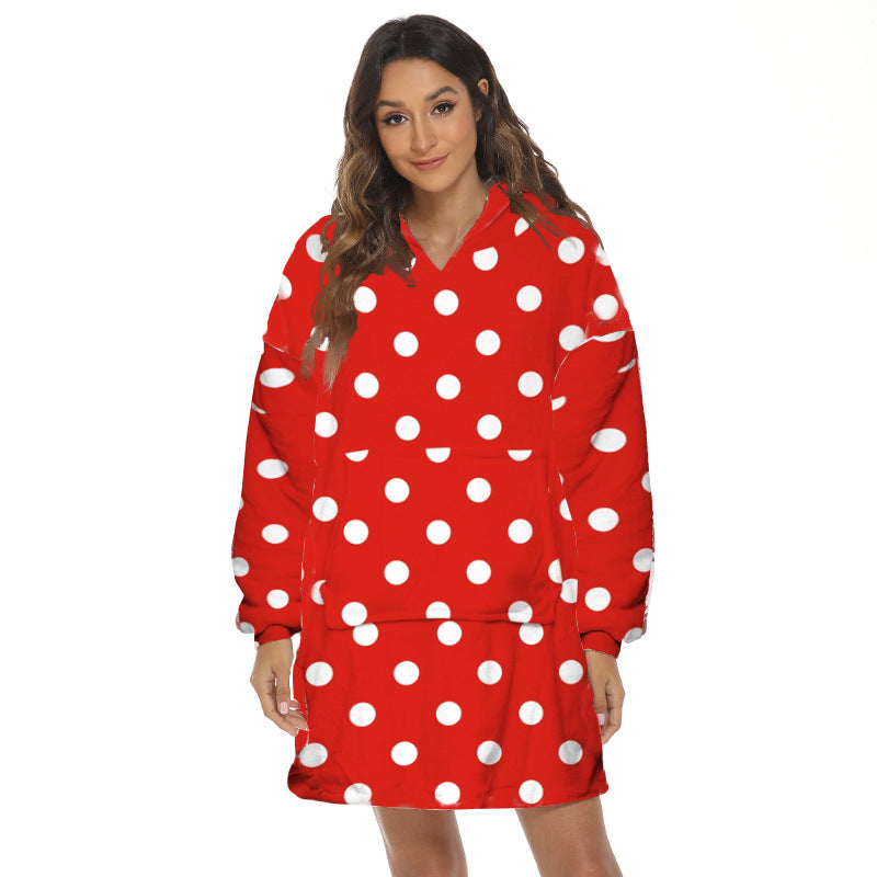 Person wearing oversized hooded blanket