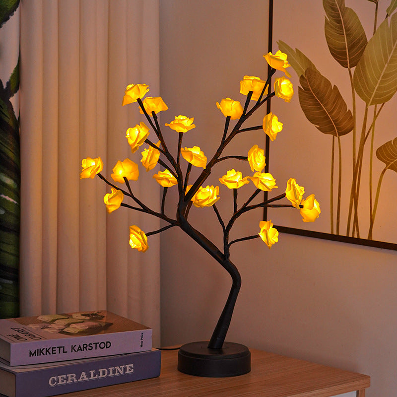 Glowing rose tree lamp on a table