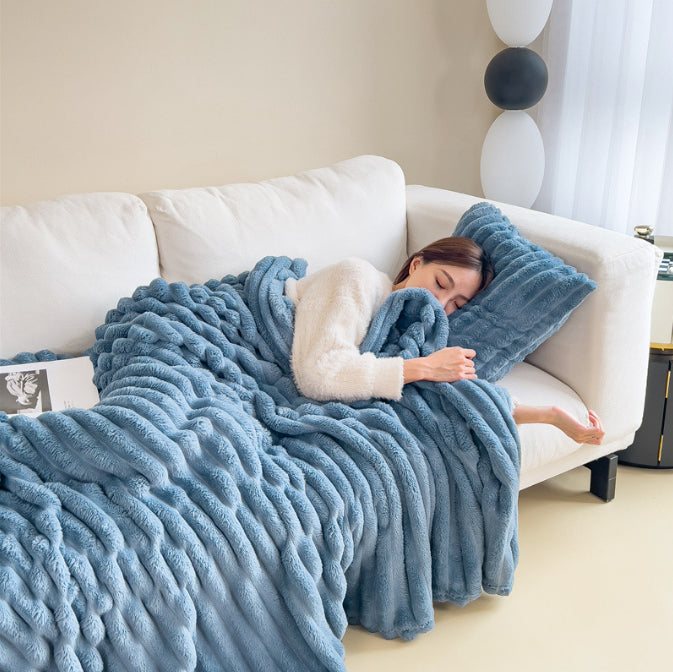 Ribbed faux fur blanket on a sofa