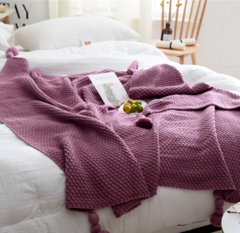 Waffle knit throw with pom-pom fringe