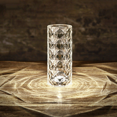 Crystal rose lamp projecting rose shadows