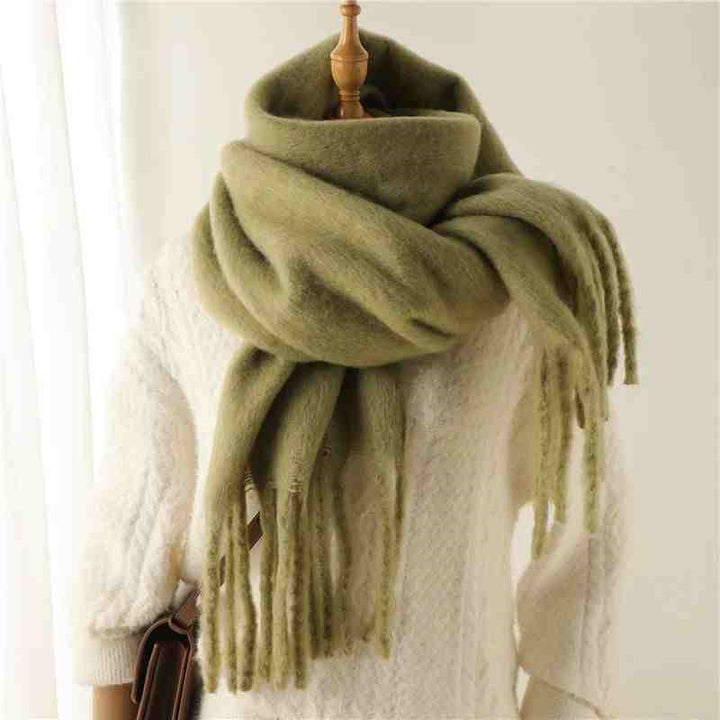 Woman wearing a fluffy mustard scarf