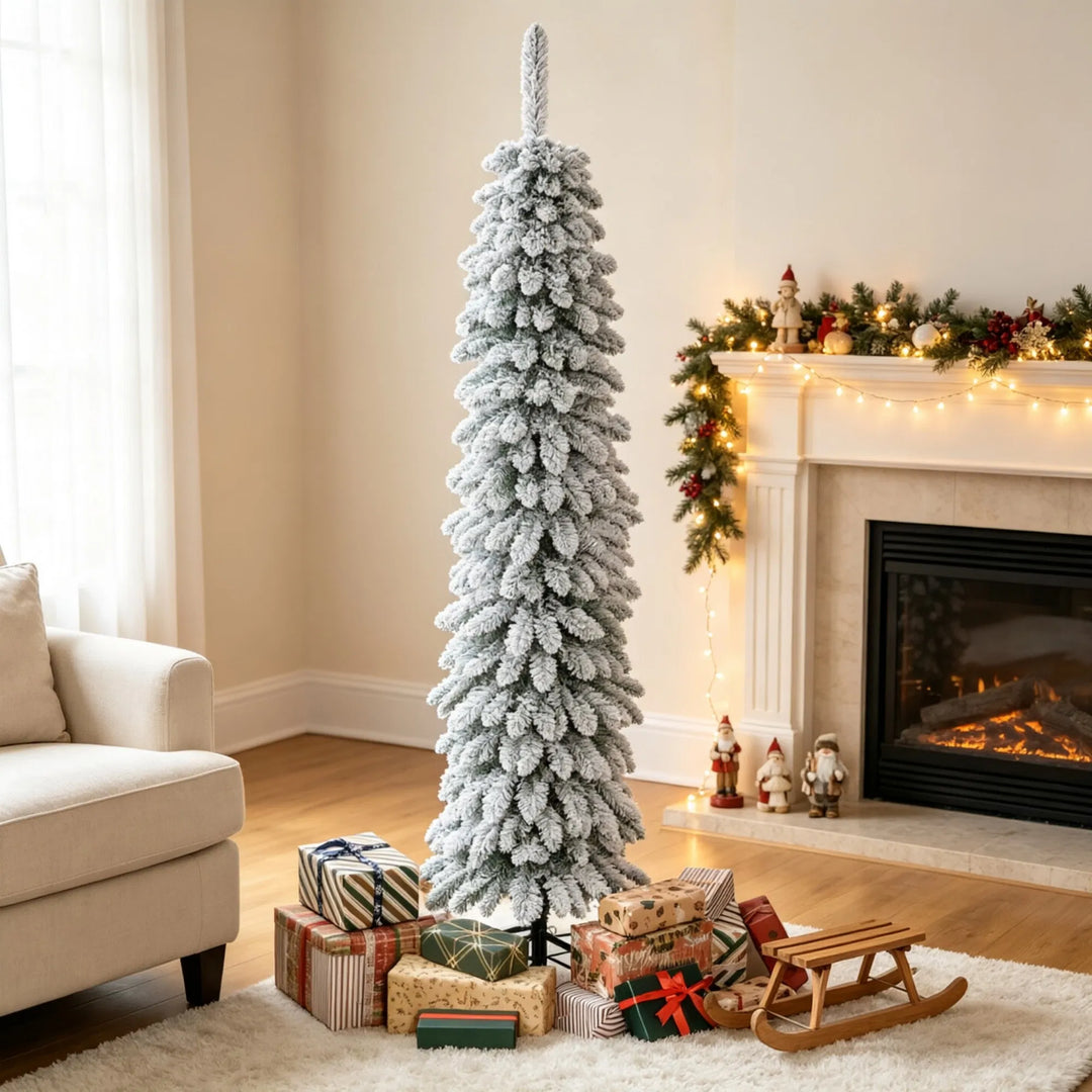 Slim snow flocked pencil Christmas tree in corner