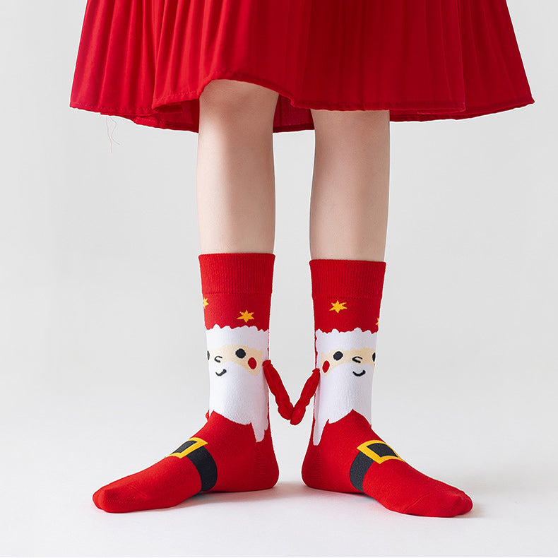 Couple wearing magnetic Christmas socks