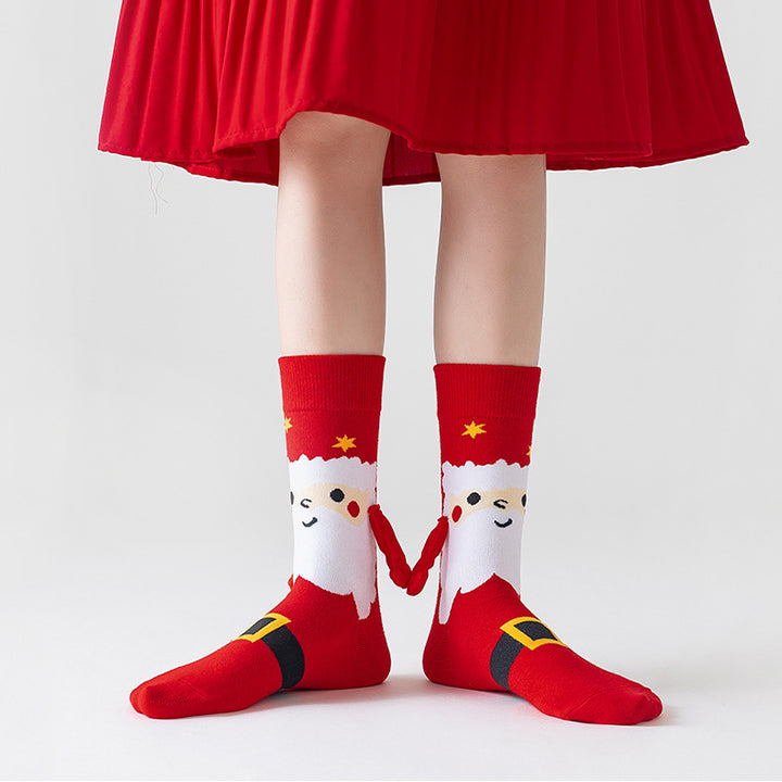 Couple wearing magnetic Christmas socks