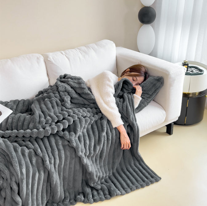 Ribbed faux fur blanket on a sofa