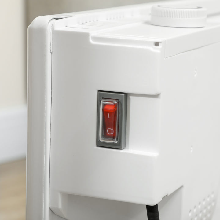 White freestanding convection heater on a wood floor