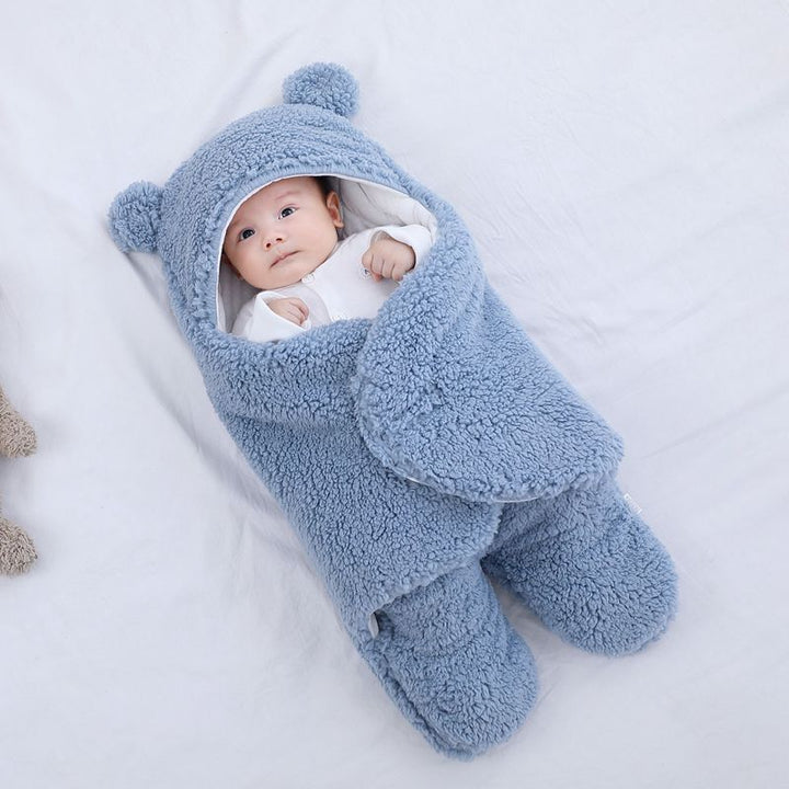 Baby in a bear ear sleep sack