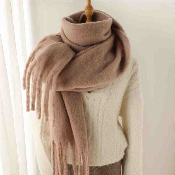 Woman wearing a fluffy mustard scarf