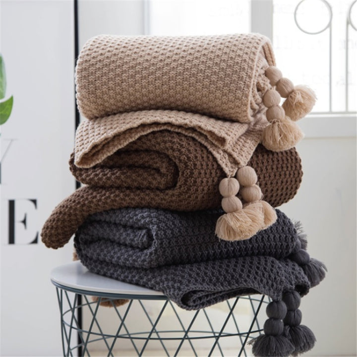 Waffle knit throw with pom-pom fringe