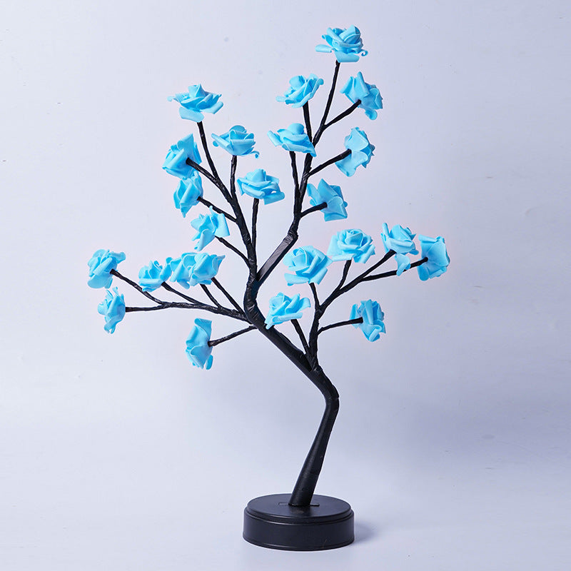 Glowing rose tree lamp on a table
